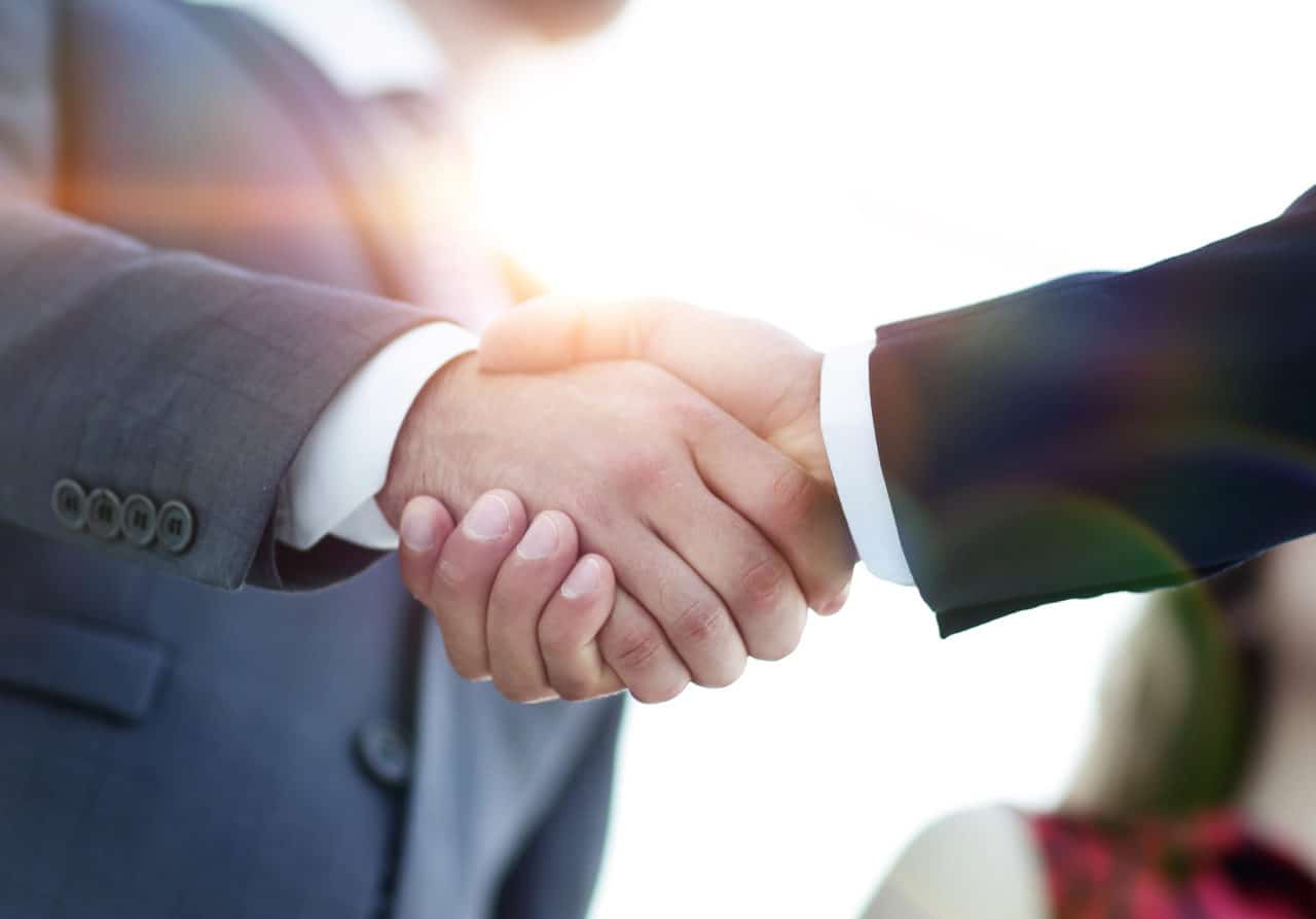 Business partnership meeting concept. Image businessman handshake.